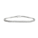 18ct white gold diamond tennis bracelet with round brilliant cut diamonds in four-claw settings.