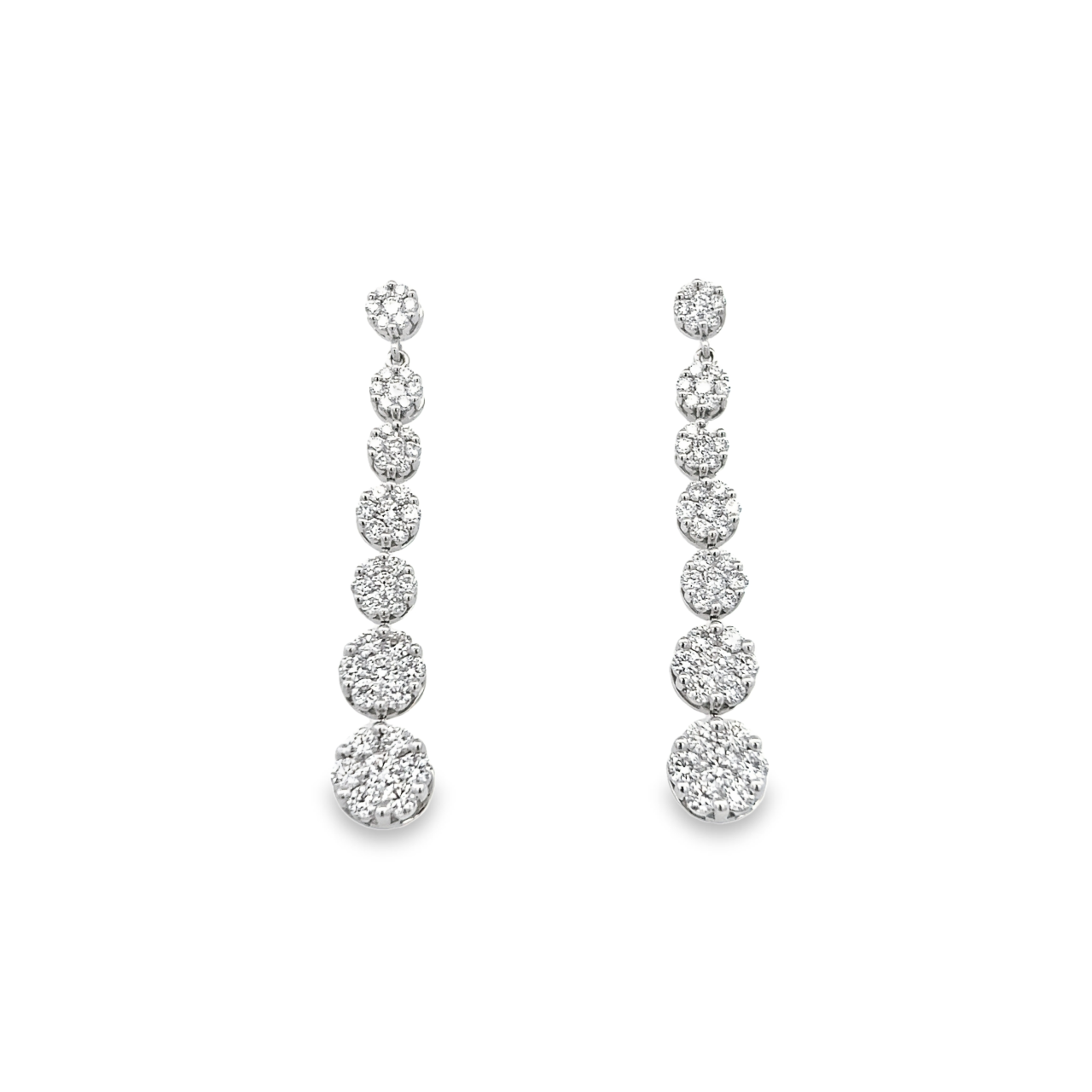 18ct white gold graduated cluster diamond drop earrings with articulated settings.