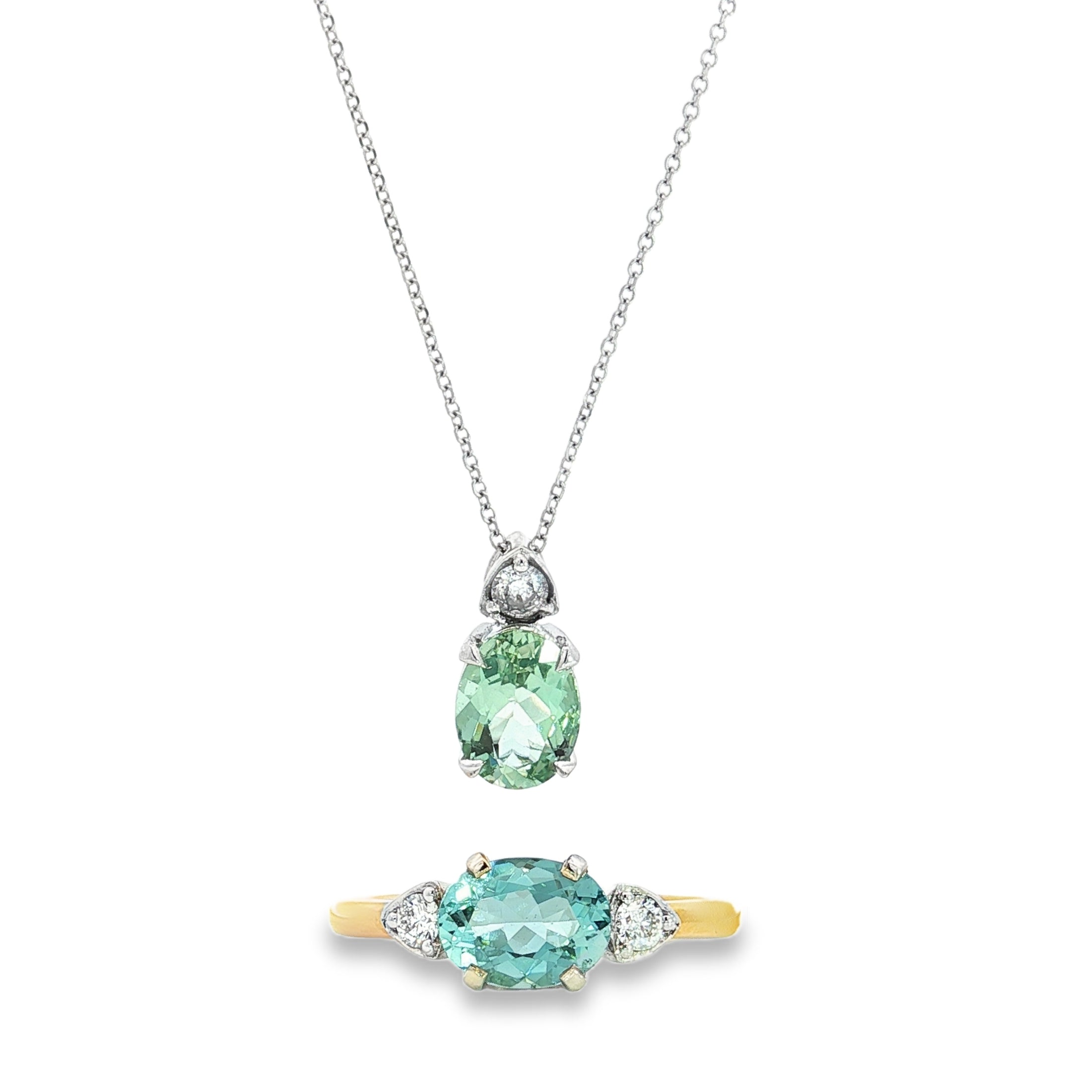9ct white gold green beryl and diamond pendant with oval green beryl and triangular diamond accent.
