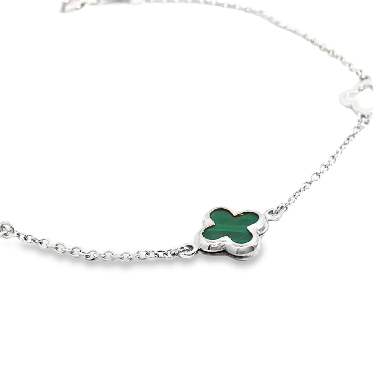 9ct white gold trace link bracelet with green clover charm and two open clover motifs.