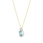 9ct white gold oval aquamarine and diamond pendant with triangular diamond accent.