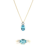9ct white gold oval aquamarine and diamond pendant with triangular diamond accent.