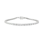 18ct white gold tennis bracelet with oval brilliant cut diamonds in four-claw settings.