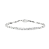 18ct white gold tennis bracelet with oval brilliant cut diamonds in four-claw settings.