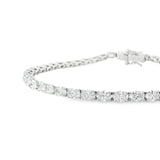18ct white gold tennis bracelet with oval brilliant cut diamonds in four-claw settings.