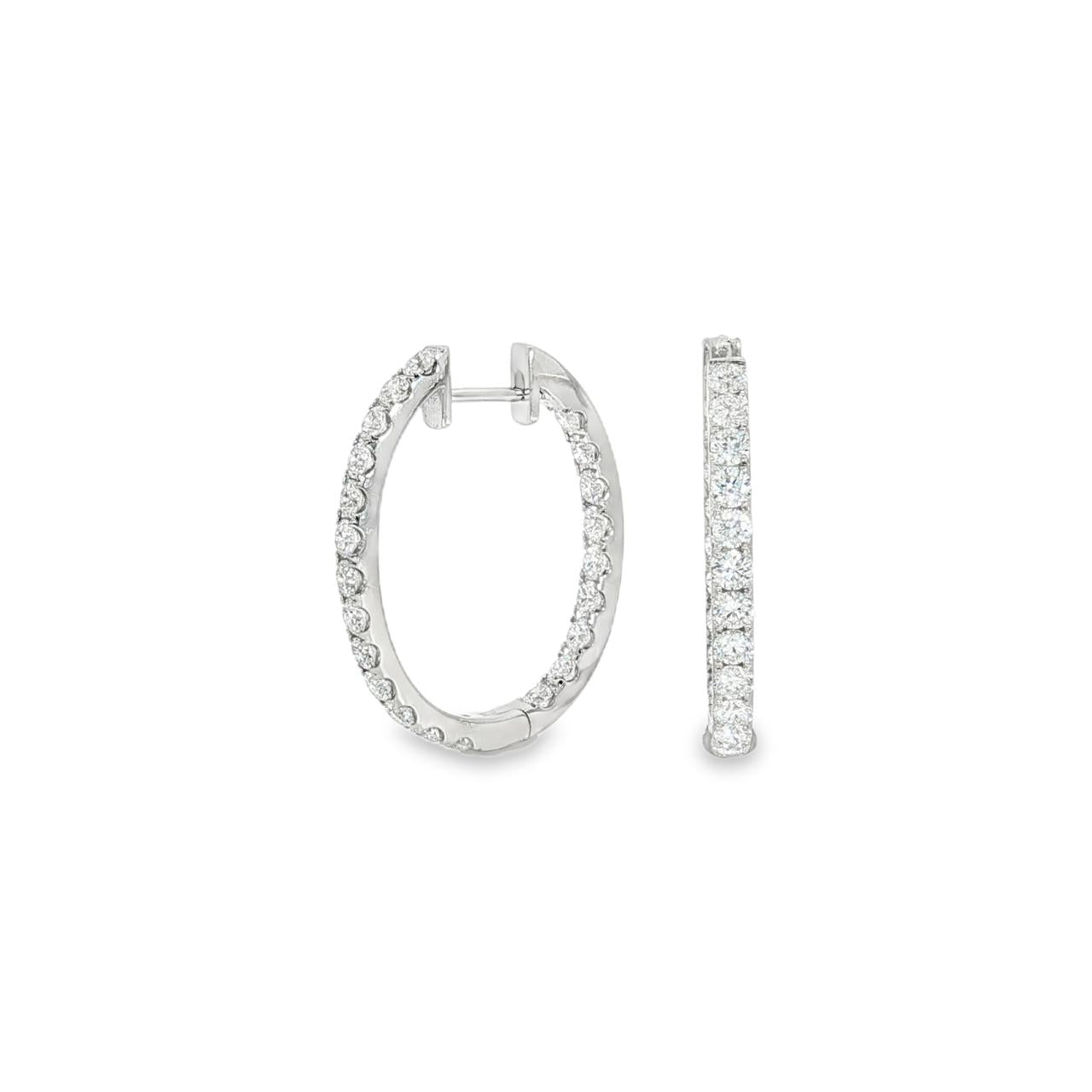 18ct white gold oval diamond huggie earrings with diamonds along the front and inside back.