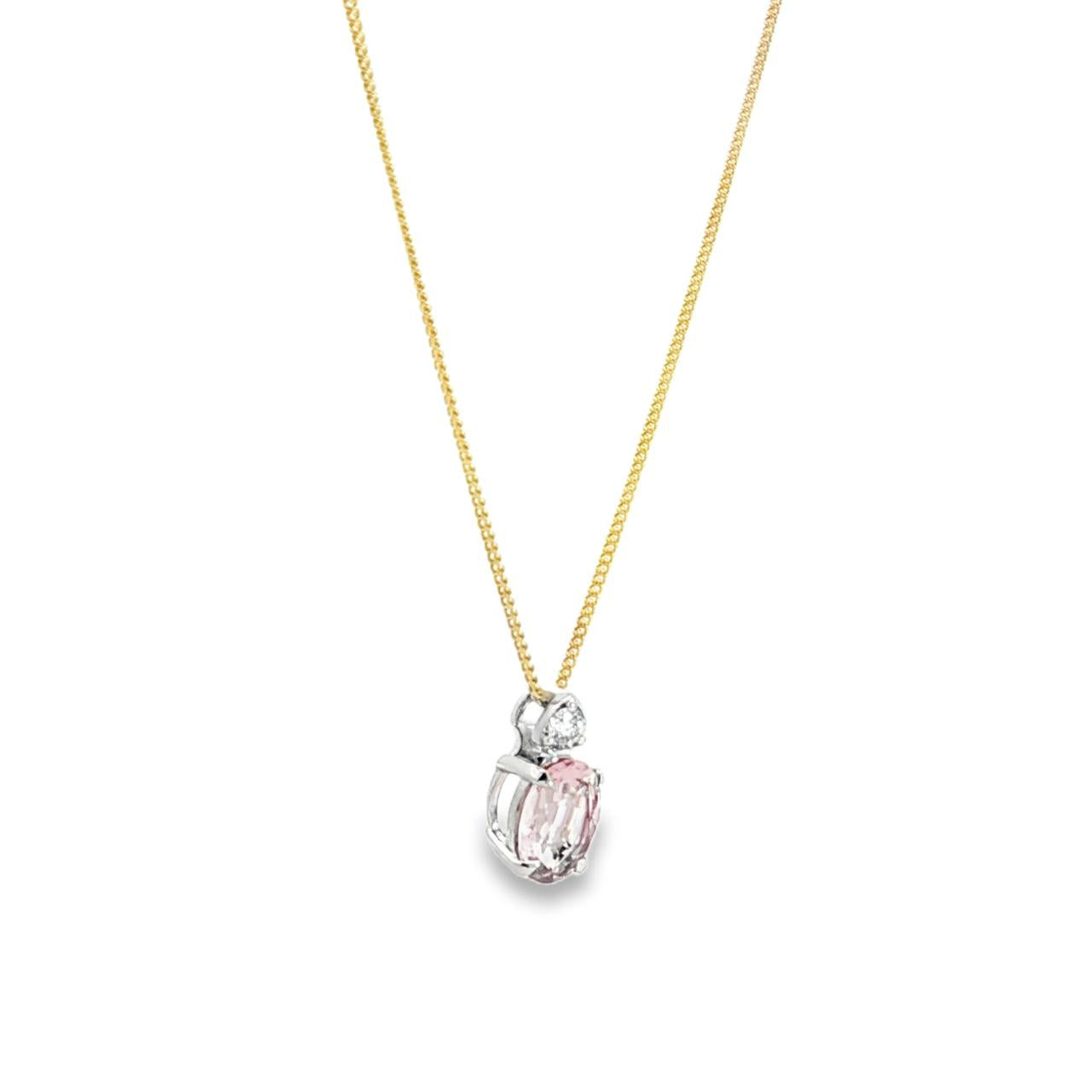 9ct white gold oval morganite and diamond pendant with triangular diamond detail.