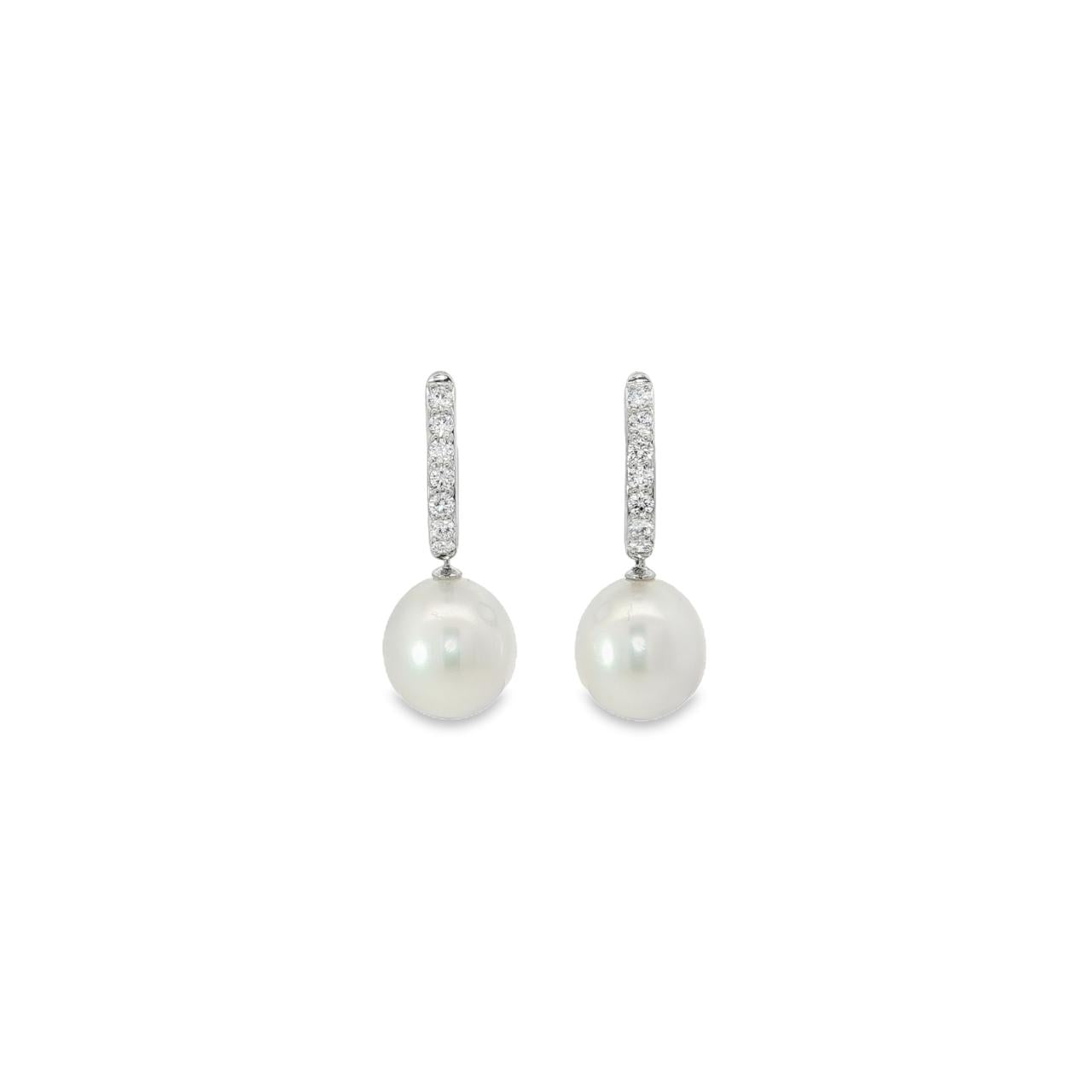 18ct white gold huggie earrings with claw-set diamonds and 11mm South Sea pearl drops.