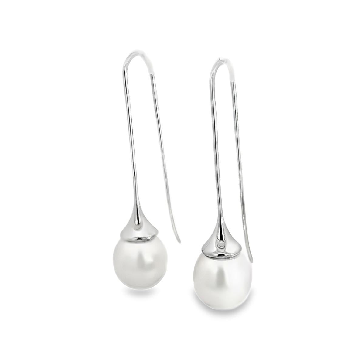 18ct white gold long hook earrings with 11mm oval South Sea pearls.