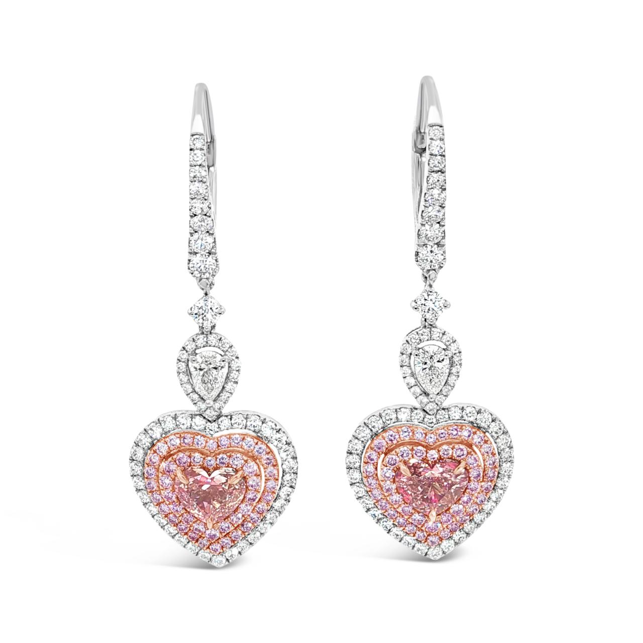 White and rose gold articulated heart-shaped diamond earrings with pink and white diamond triple halo design.