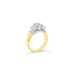 18ct yellow and white gold diamond ring featuring a 0.91ct cushion cut centre diamond with Fancy Yellow side diamonds and round diamond accents.