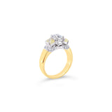 18ct yellow and white gold diamond ring featuring a 0.91ct cushion cut centre diamond with Fancy Yellow side diamonds and round diamond accents.