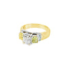 18ct yellow and white gold diamond ring featuring a 0.91ct cushion cut centre diamond with Fancy Yellow side diamonds and round diamond accents.