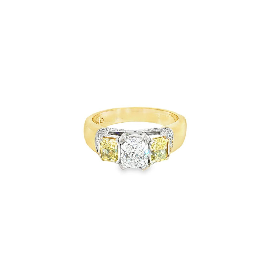 18ct yellow and white gold diamond ring featuring a 0.91ct cushion cut centre diamond with Fancy Yellow side diamonds and round diamond accents.