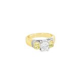 18ct yellow and white gold diamond ring featuring a 0.91ct cushion cut centre diamond with Fancy Yellow side diamonds and round diamond accents.