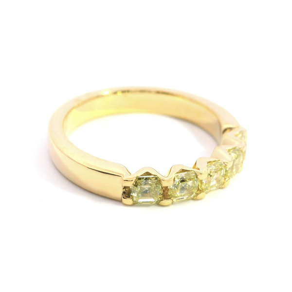 18ct yellow gold ring featuring five Asscher cut yellow diamonds in a shared claw setting with V-shaped collets.
