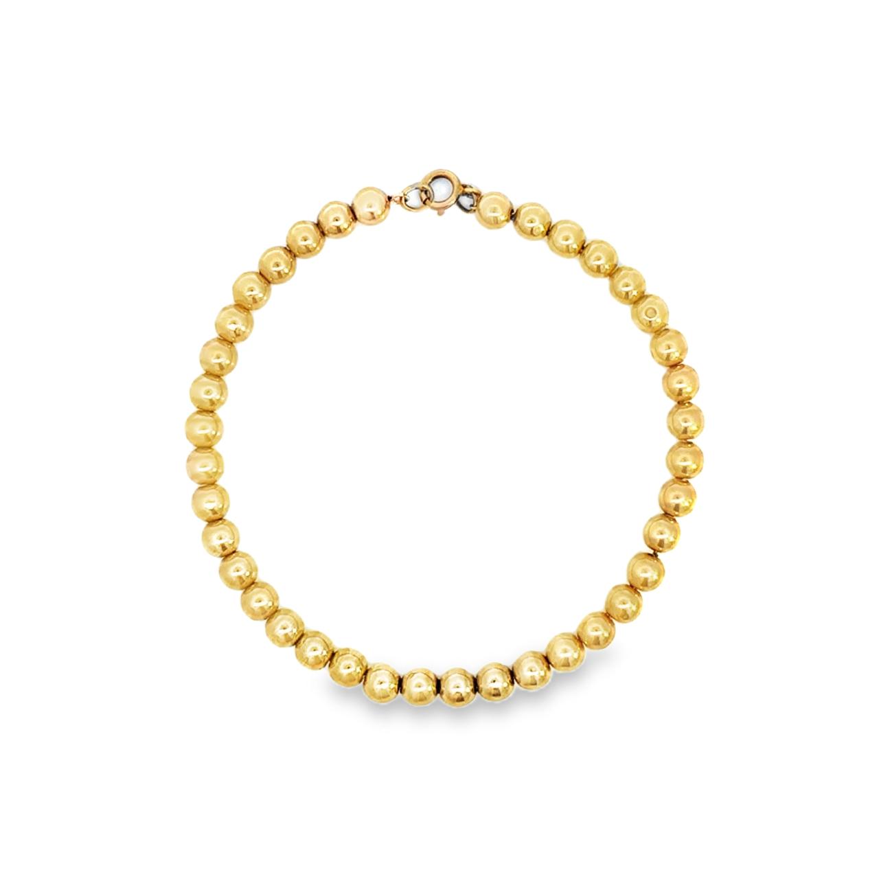 Yellow gold bracelet featuring polished 5mm ball links and a bolt ring clasp.