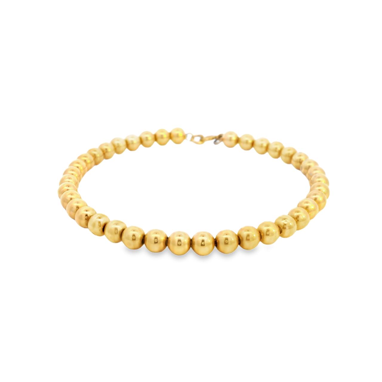 Yellow gold bracelet featuring polished 5mm ball links and a bolt ring clasp.