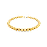 Yellow gold bracelet featuring polished 5mm ball links and a bolt ring clasp.