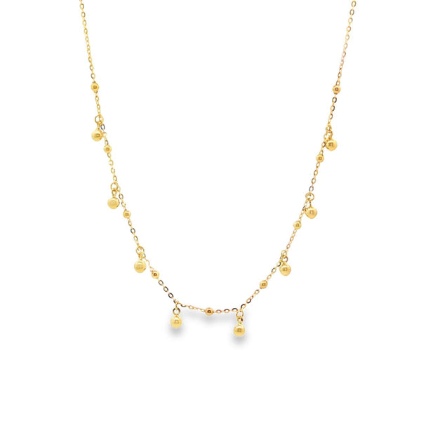 9ct yellow gold trace link chain with polished dangle bead accents, 45cm length.