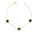 9ct yellow gold trace link bracelet with three black clover motifs.