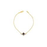 9ct yellow gold trace link bracelet with small blue clover centre.