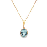 9ct yellow gold oval blue topaz pendant with checkerboard cut and bezel setting.
