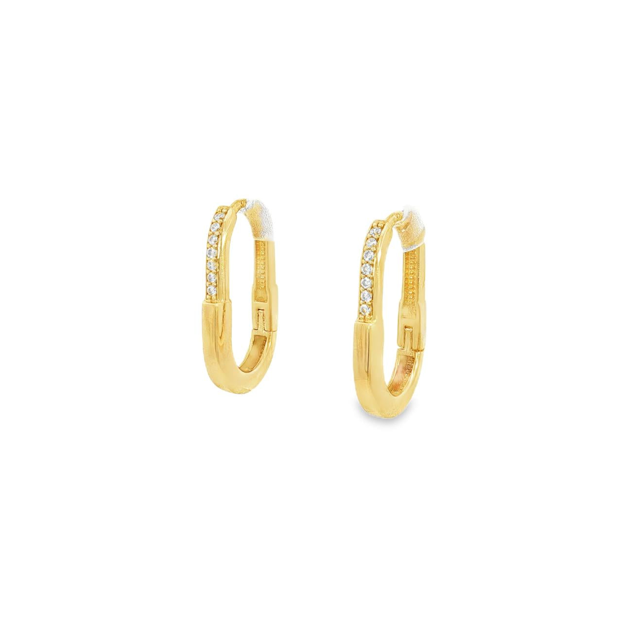 9ct yellow gold oval carabiner-style huggie earrings with cubic zirconias on the top half.