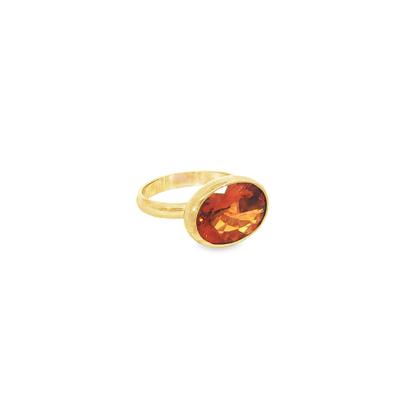 9ct yellow gold citrine ring with horizontal oval citrine in suspension-style bezel setting.