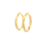 9ct yellow gold 30mm hoop earrings with polished cushion-profile tubing.