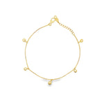 18ct yellow gold fine trace link bracelet with five pear-shaped diamond drops spaced along the length, finished with a parrot clasp.