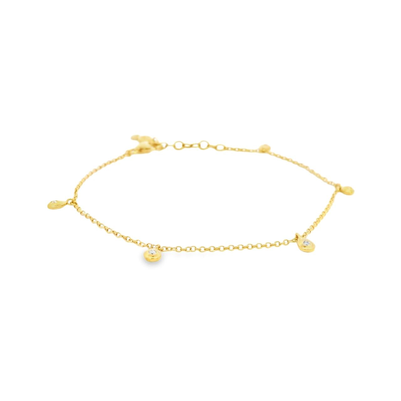 18ct yellow gold fine trace link bracelet with five pear-shaped diamond drops spaced along the length, finished with a parrot clasp.