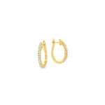 18ct yellow gold oval huggie earrings with claw-set diamonds down the front.