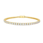 18ct yellow gold diamond tennis bracelet with round brilliant cut diamonds in four-claw settings.