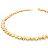 9ct yellow gold flexi bracelet with interwoven wave design and alternating teardrop elements.