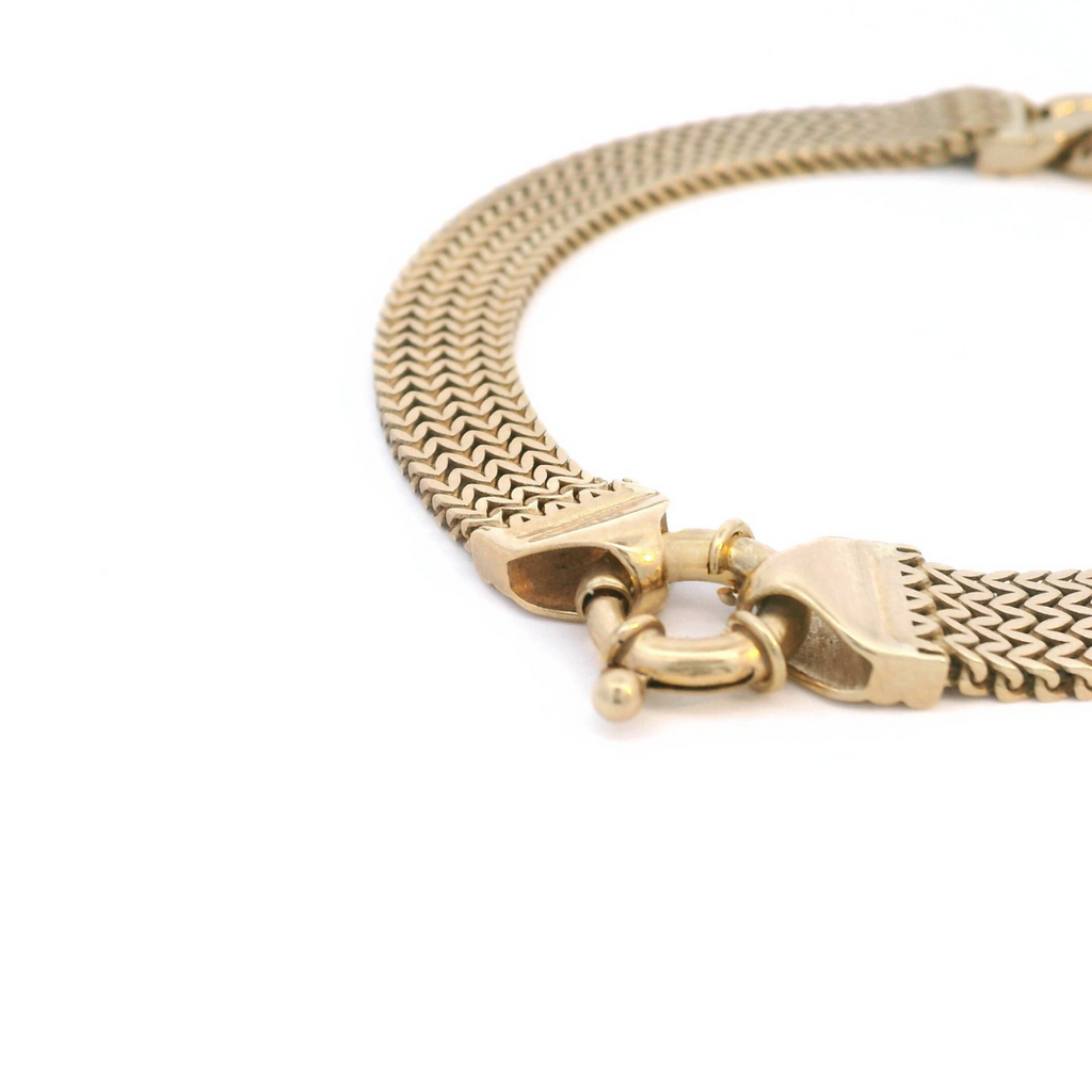 9ct yellow gold bracelet with flexible 7.3mm wide mesh link design and double curb link centre, finished with a bolt ring clasp.