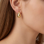 9ct yellow gold puffed pear-shaped stud earrings with polished finish.