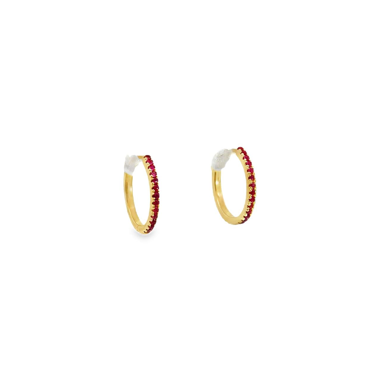 18ct yellow gold ruby huggie earrings with claw-set rubies front and back.
