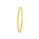 Yellow gold silver filled golf style bangle with polished finish.