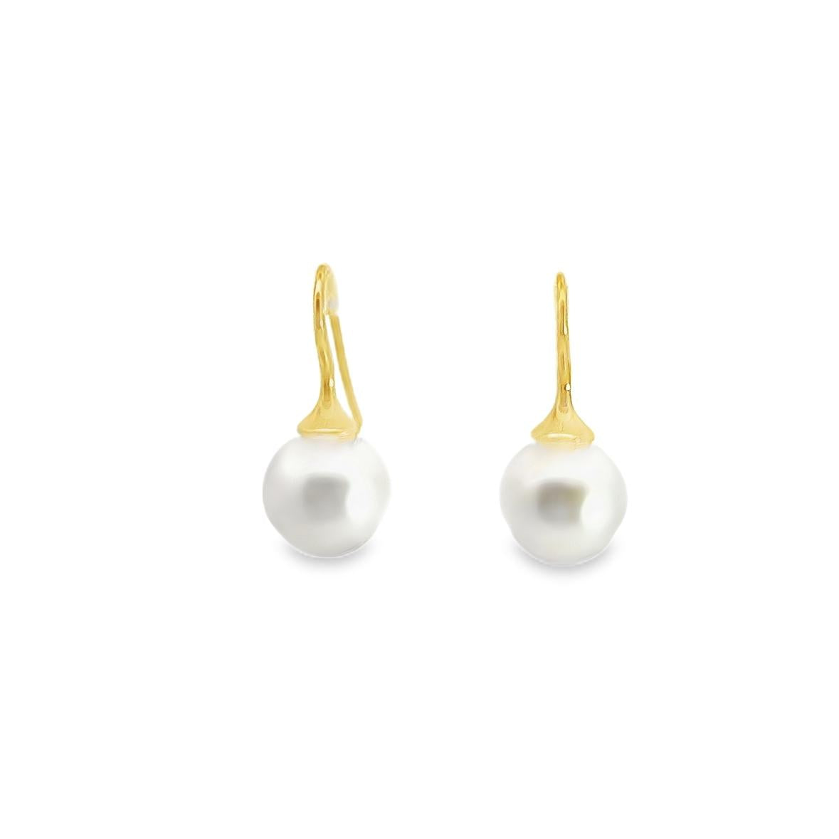 18ct yellow gold hook earrings with tapered caps and 10mm South Sea pearls.
