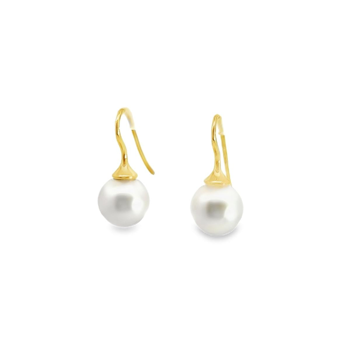 18ct yellow gold hook earrings with tapered caps and 10mm South Sea pearls.