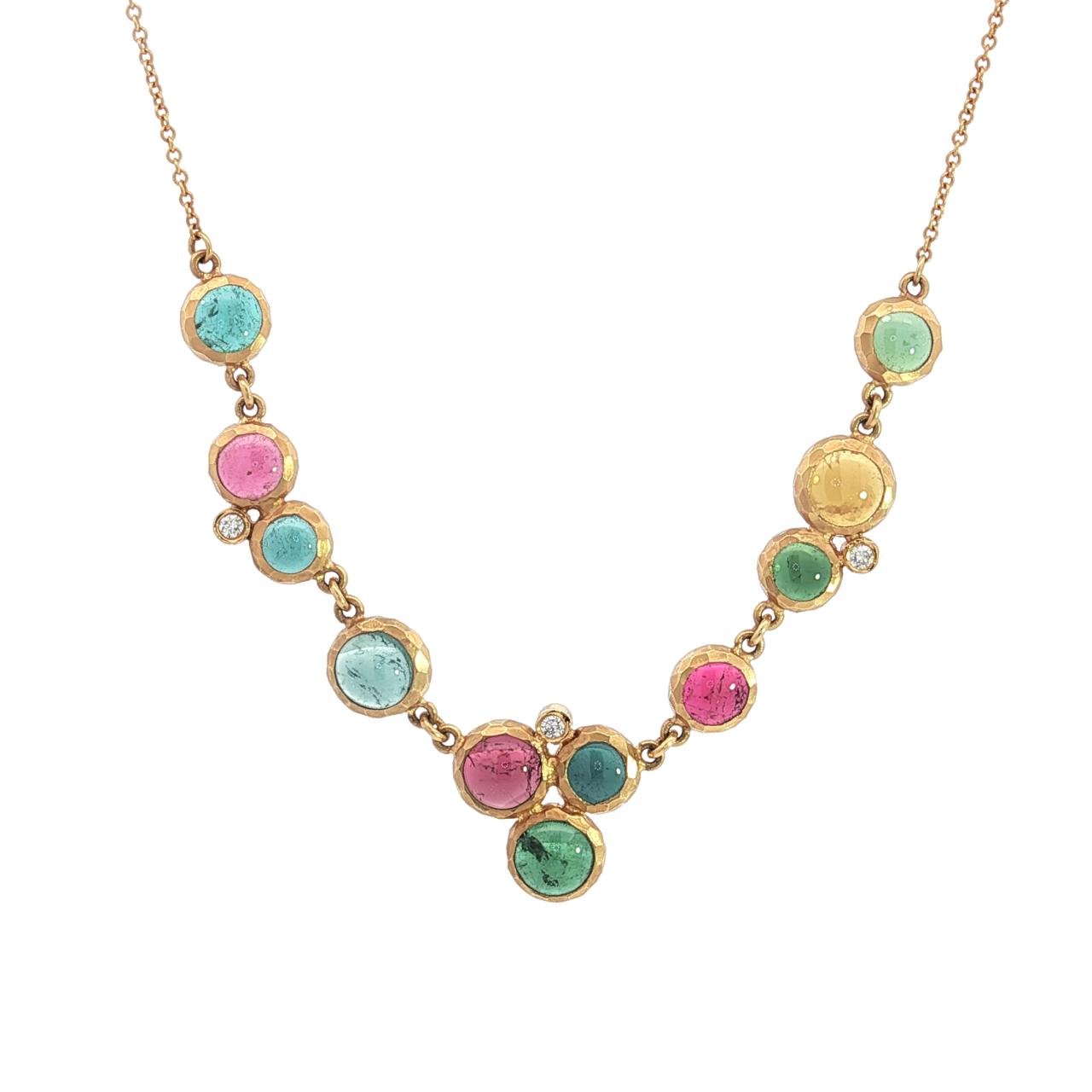 14ct yellow gold necklet with scattered bezel set cabochon tourmalines and diamond accents on trace chain.