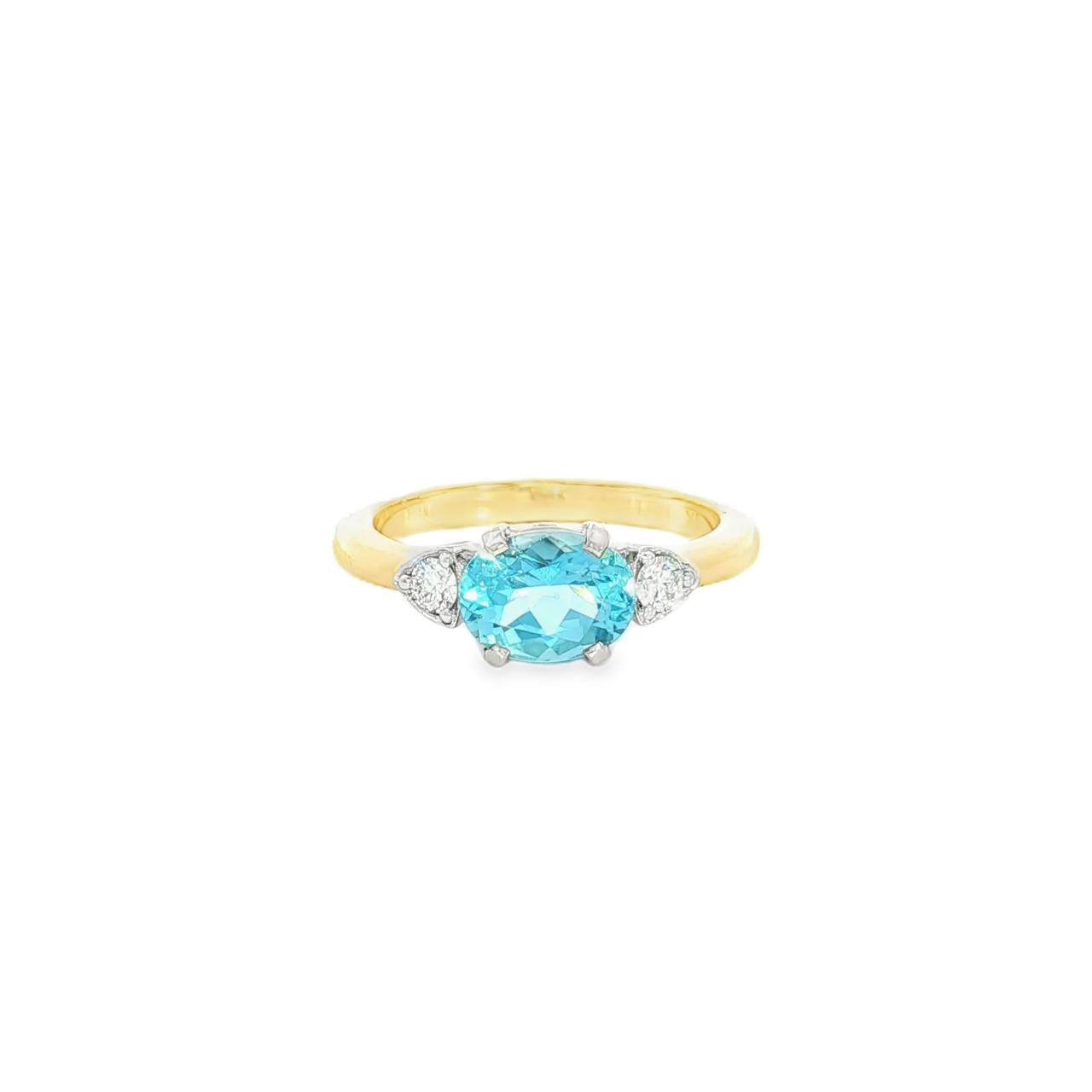 9ct yellow and white gold ring with 1.27ct horizontal oval aquamarine and triangular diamond accents.