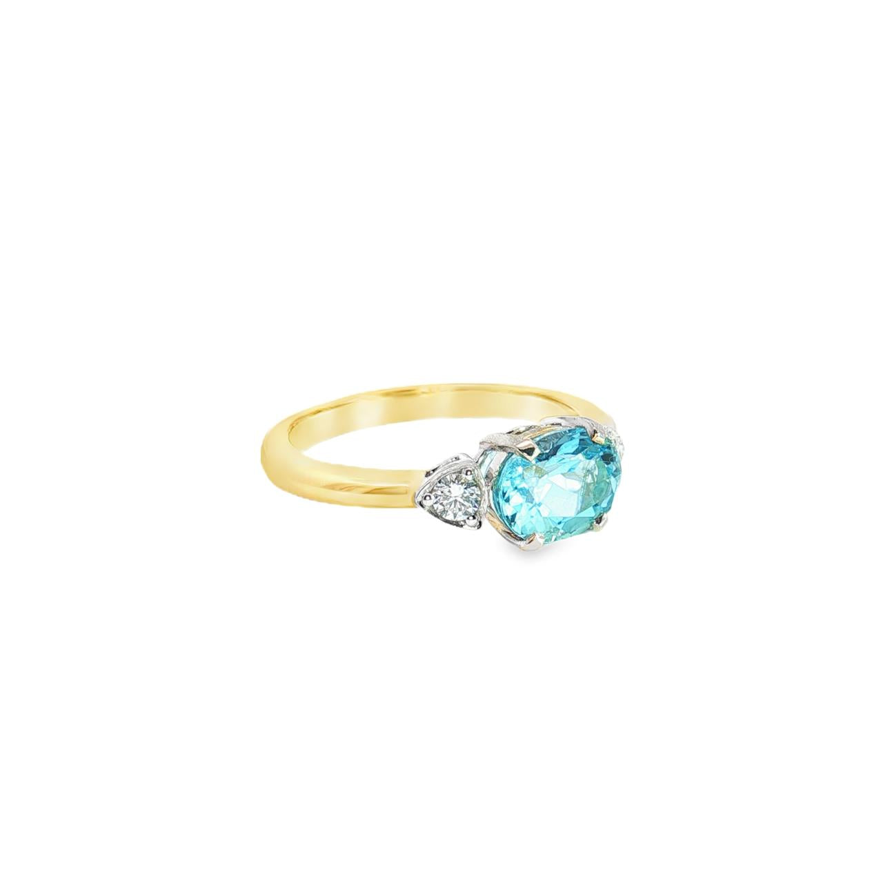 9ct yellow and white gold ring with 1.27ct horizontal oval aquamarine and triangular diamond accents.