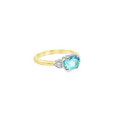 9ct yellow and white gold ring with 1.27ct horizontal oval aquamarine and triangular diamond accents.