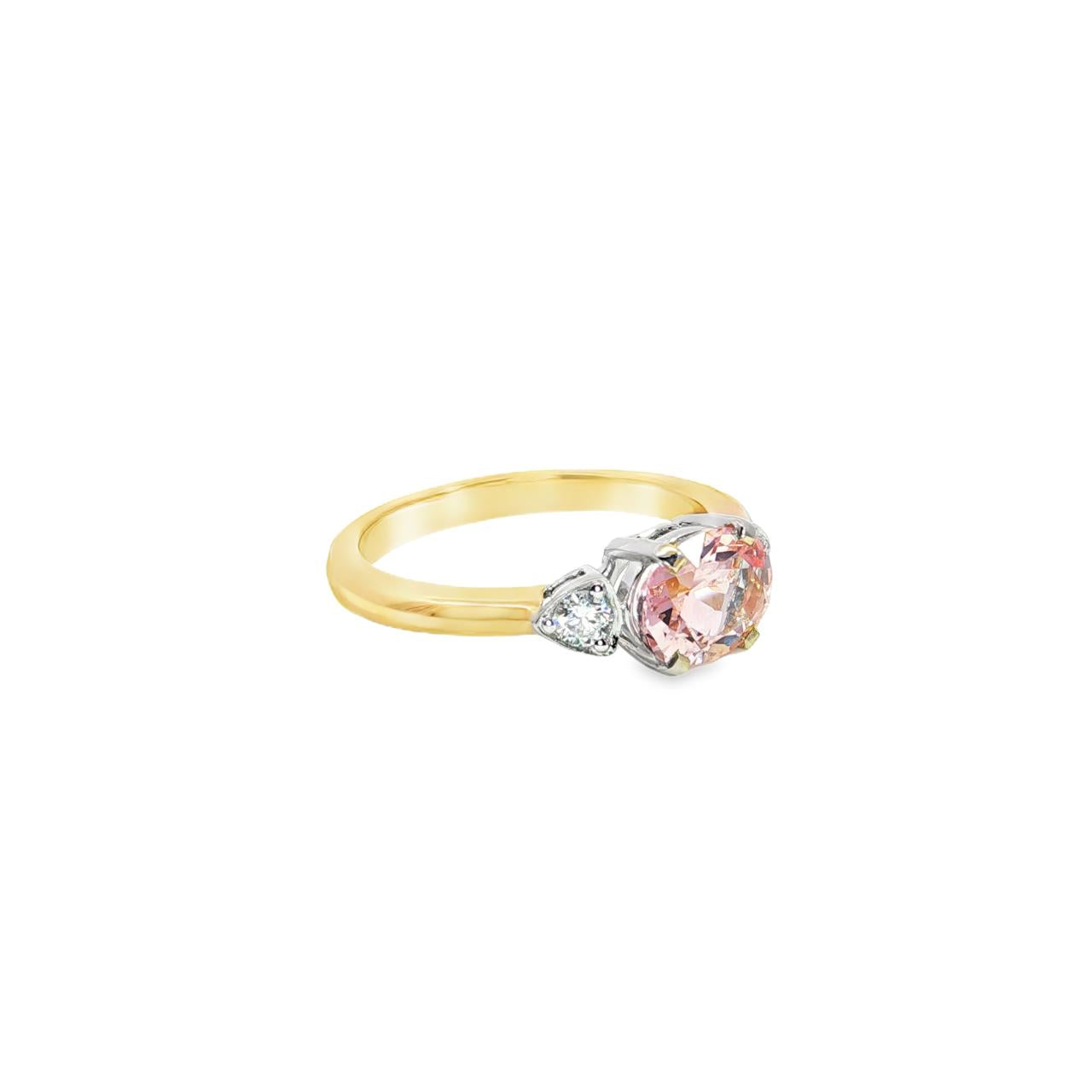 9ct yellow and white gold ring with horizontal oval morganite and diamond side accents.