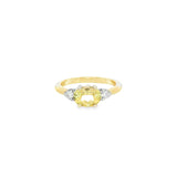 Yellow and white gold ring with horizontal oval yellow beryl and diamond side accents.
