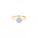 18ct yellow and white gold diamond halo ring featuring a 0.20ct centre diamond with a halo of ten smaller round brilliant cut diamonds.