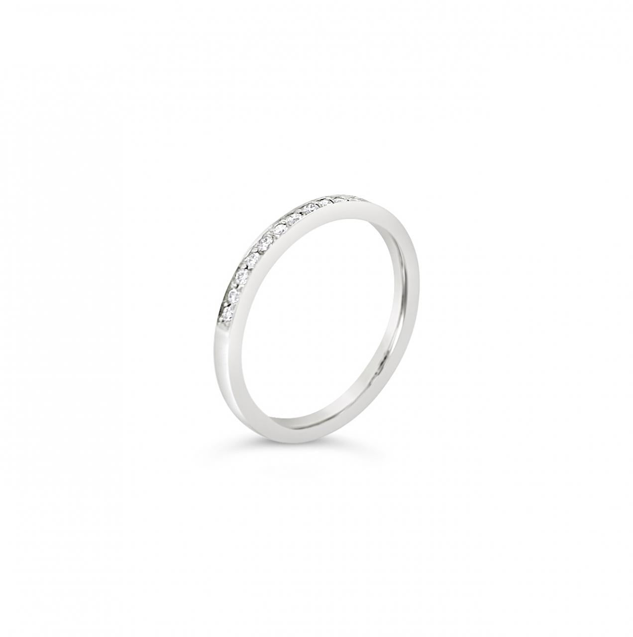 18ct white gold wedding ring featuring twelve round brilliant cut diamonds totalling 0.12ct in fine bead settings across the top.
