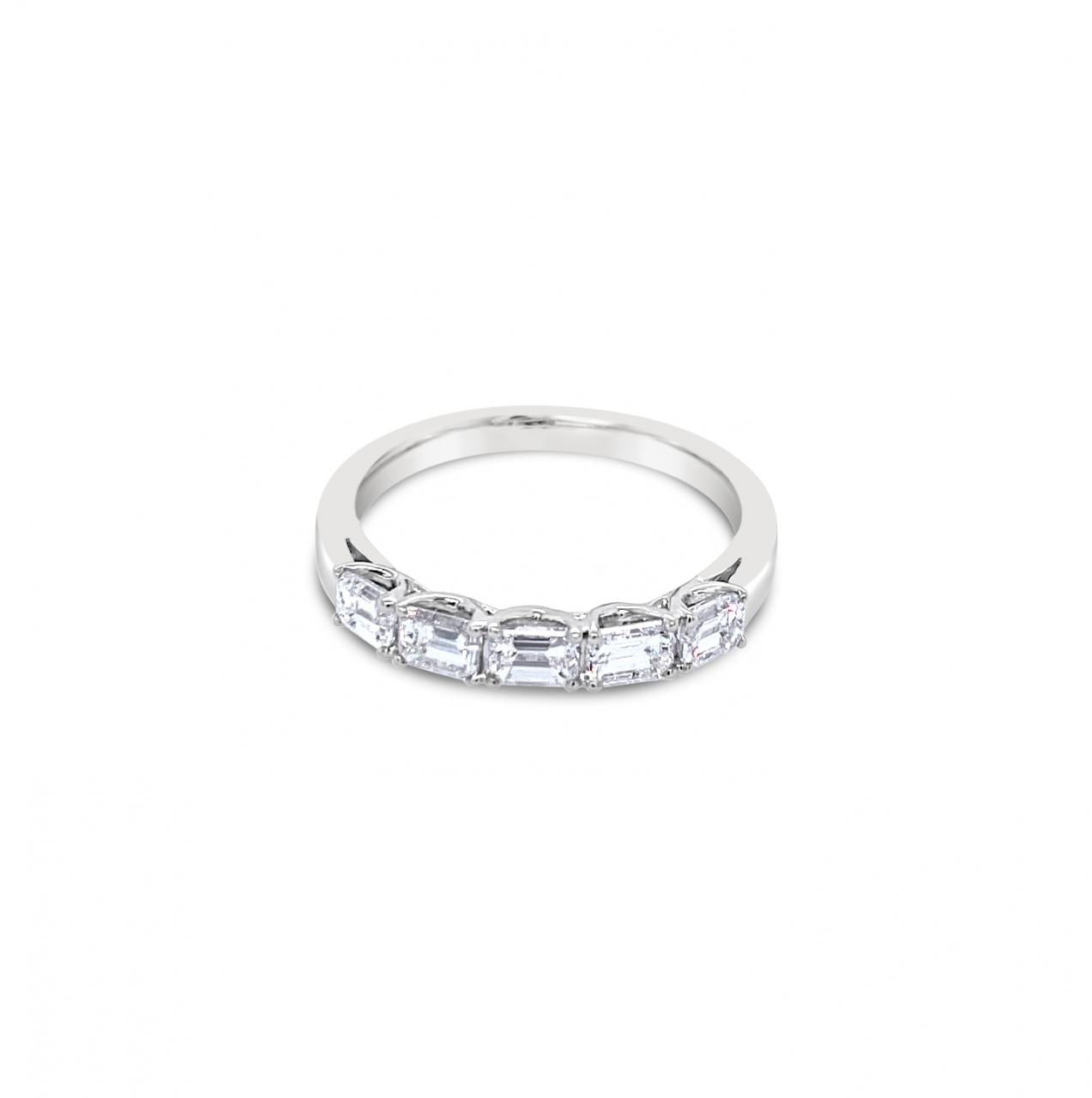 18ct white gold ring featuring five horizontally set emerald cut diamonds totalling 0.92ct in refined claw settings.